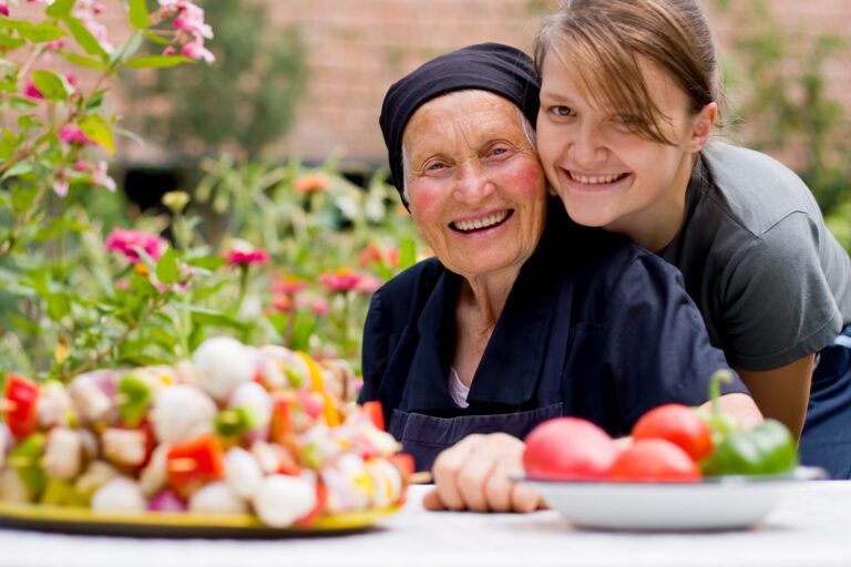 Caregiver Smiling With Senior Women