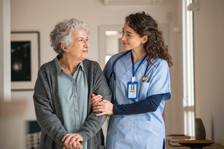 Caregiver Smiling With Elderly Women